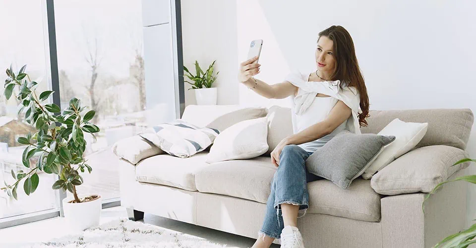 Woman taking a selfie for social media