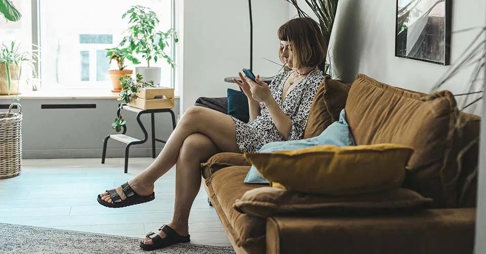 Woman texting at home