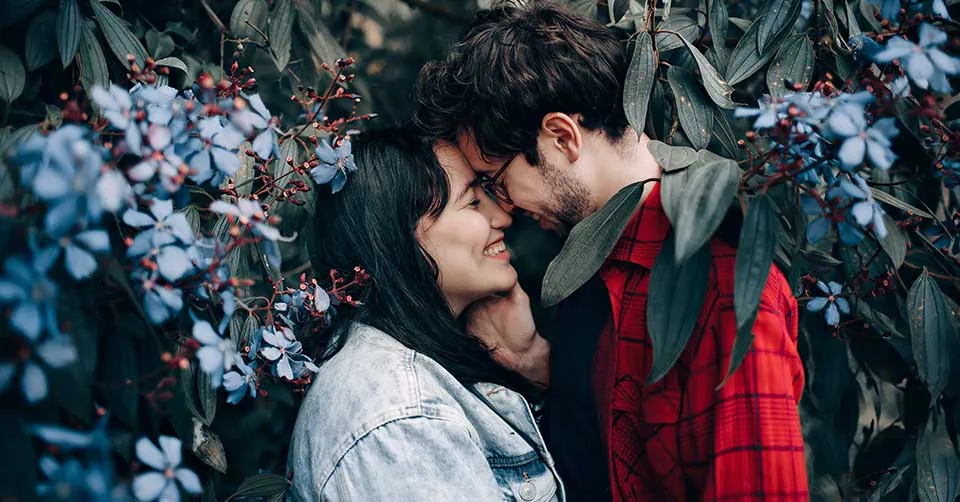 A couple kissing in a park