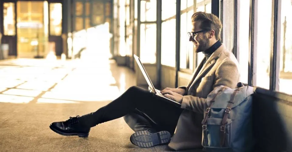 Well dressed business guy at the airport waiting