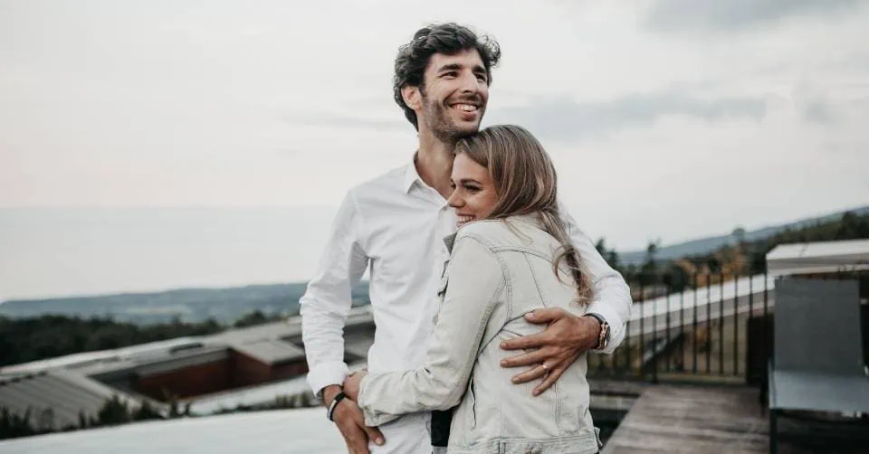 Girl hugging a guy after he teased her