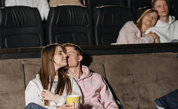 A couple making out at the movies