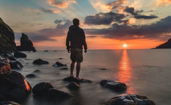 Man looking at a sunset