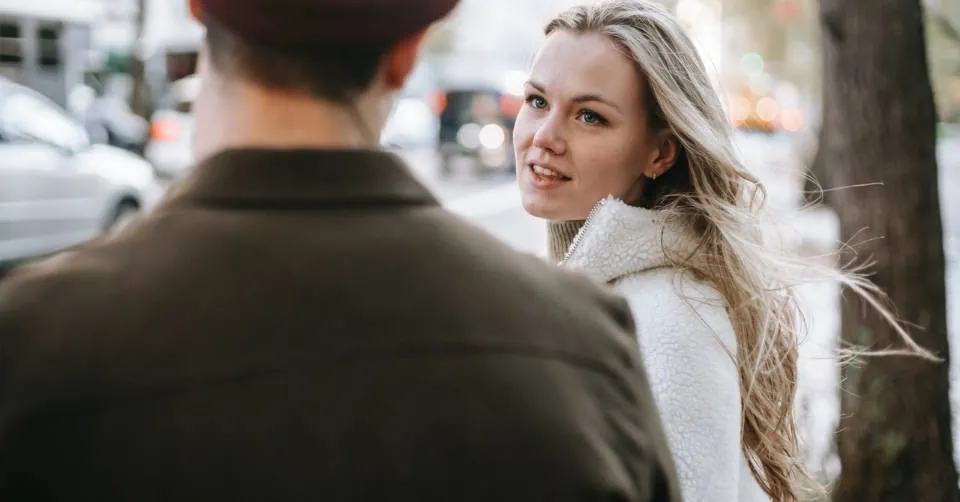 Single guy talking to a girl on the street