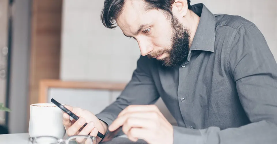 A confused man being tested by a woman over text