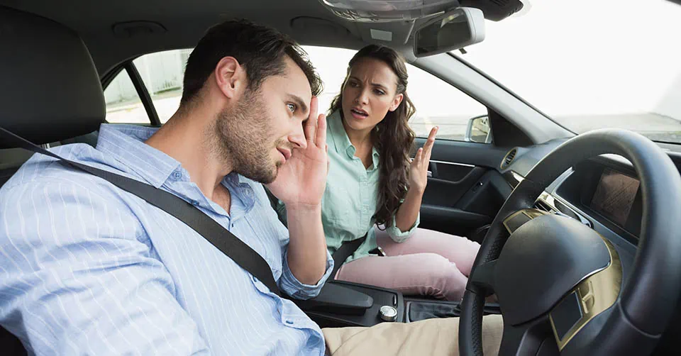 A couple arguing in a car