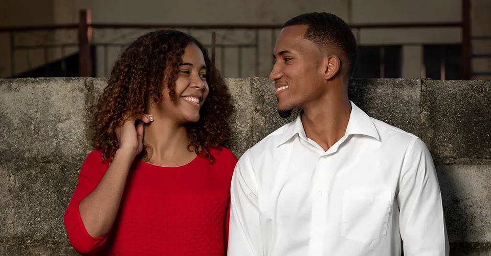 A man and woman making eye contact