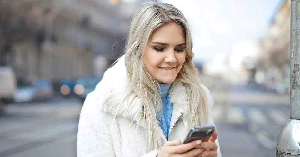 A woman enjoying her text conversation