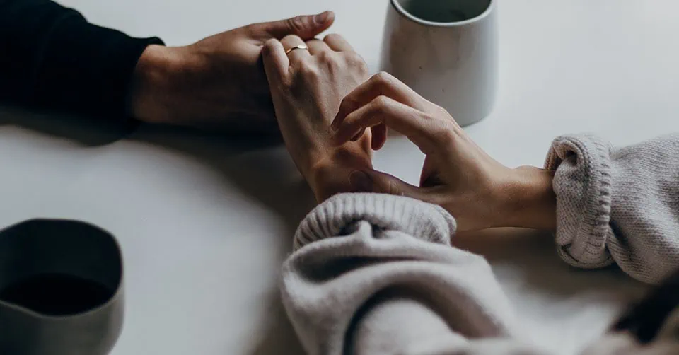 Holding hands across the table