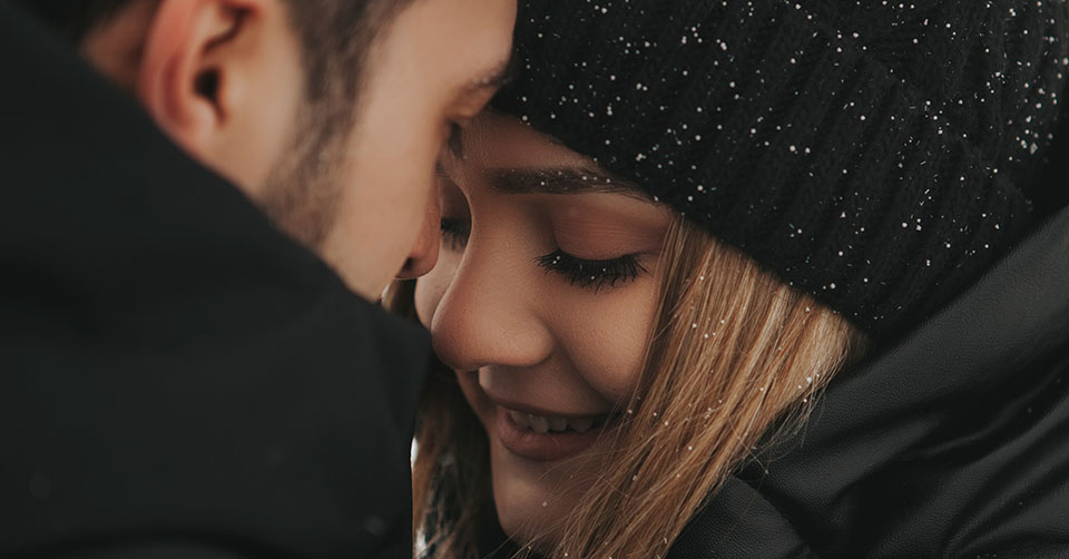 A couple on a date in the snow