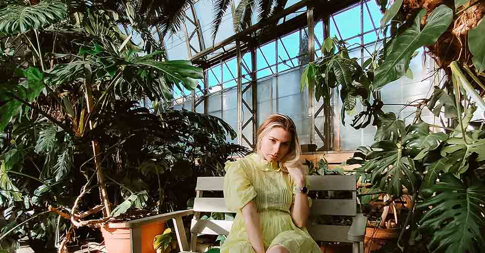 Sexy woman in a greenhouse