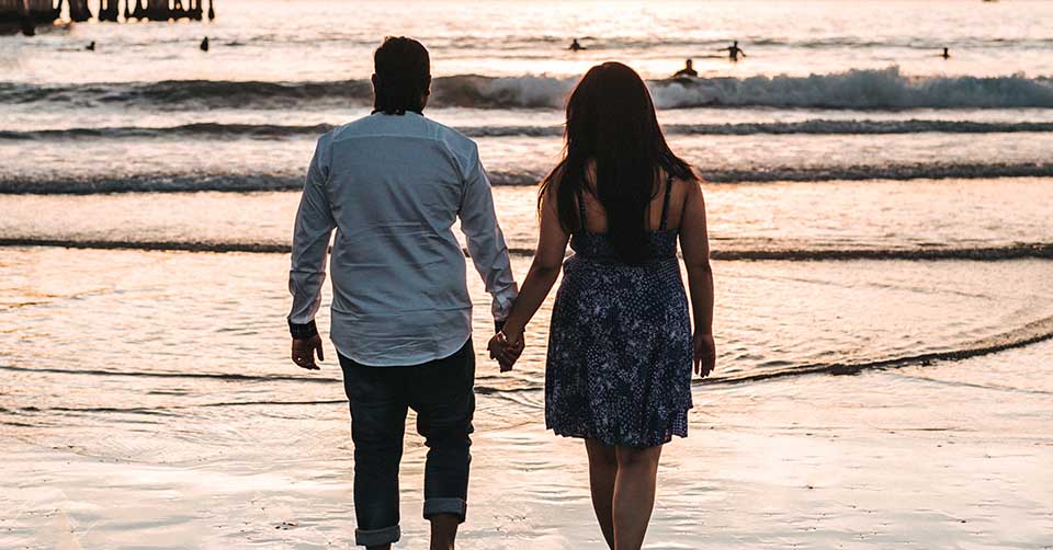 A couple on a date at the beach