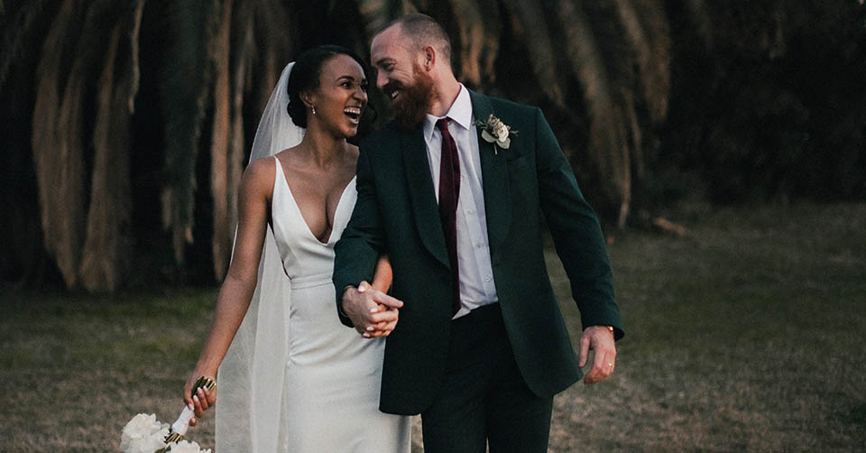 A married couple walking in a park