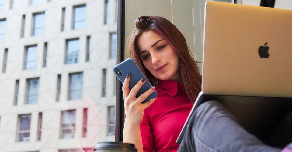 A woman using the best Lubbock dating apps while at work