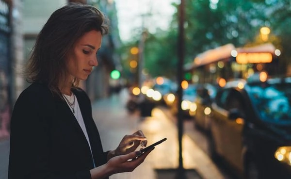 A woman calling a cab to meet someone she met on a Tennessee dating app