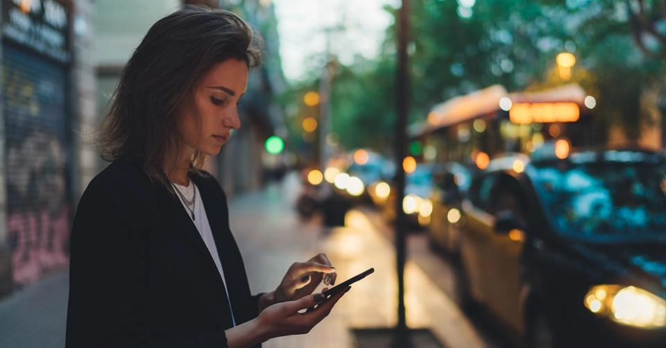 A woman calling a cab to meet someone she met on a Tennessee dating app