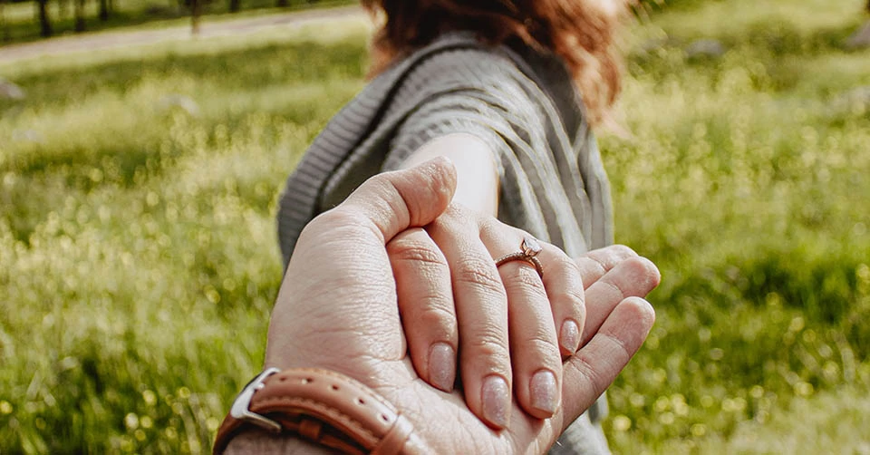 An engaged couple at the park