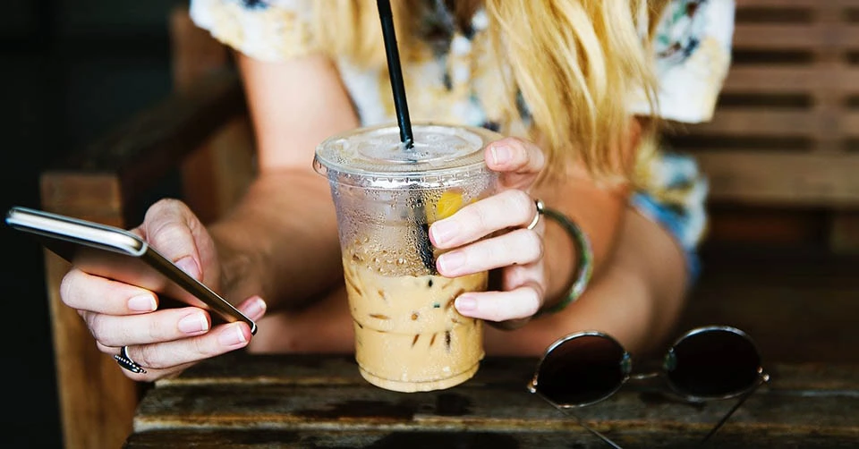 Texting while having coffee