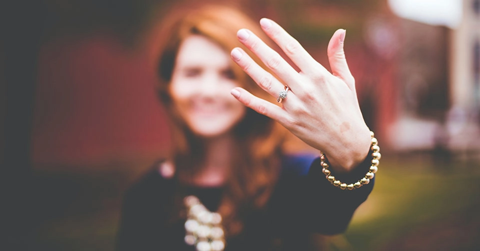 Woman showing off her engagement ring