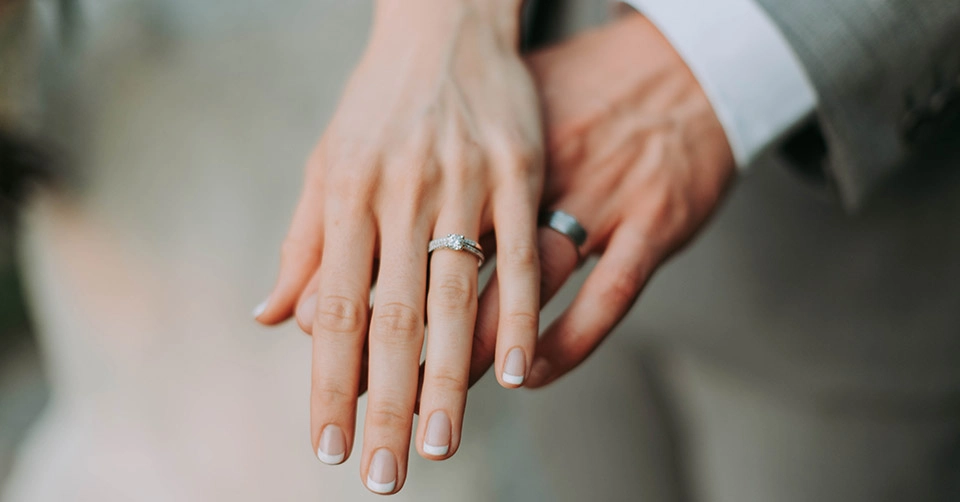 Showing off their new wedding rings