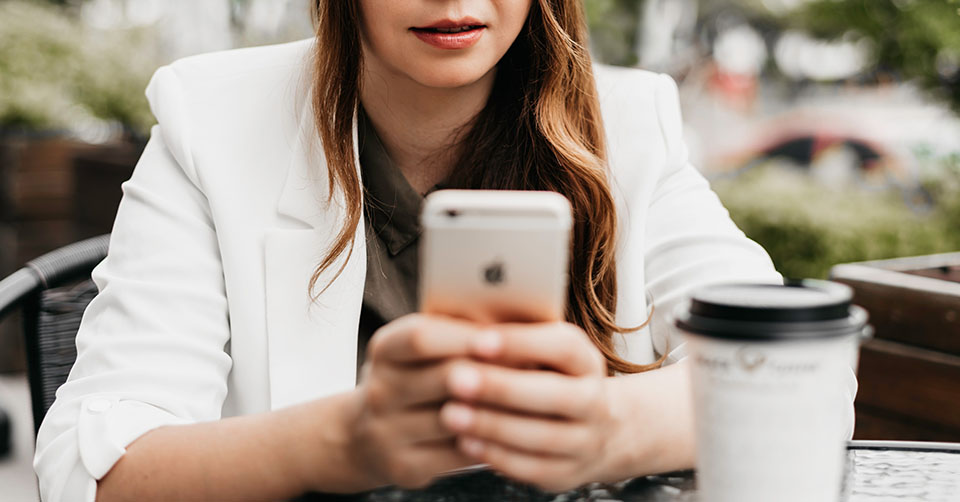 Using a dating app while drinking some coffee