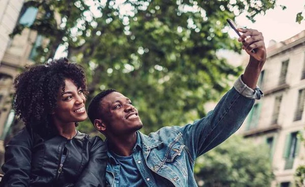 A couple taking a selfie while dating in Baltimore