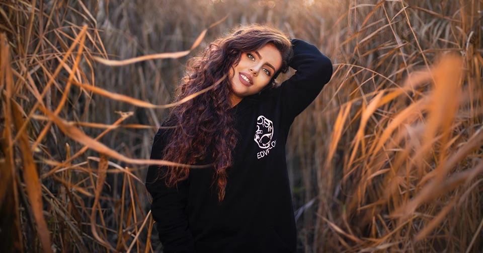 Woman in a hoodie in a field