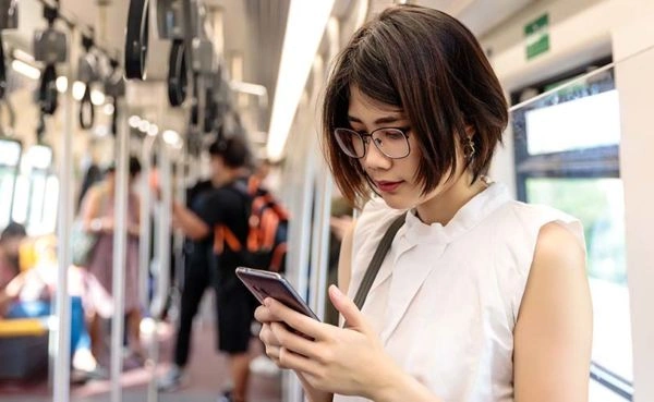 Using her favorite Vancouver dating app on the train