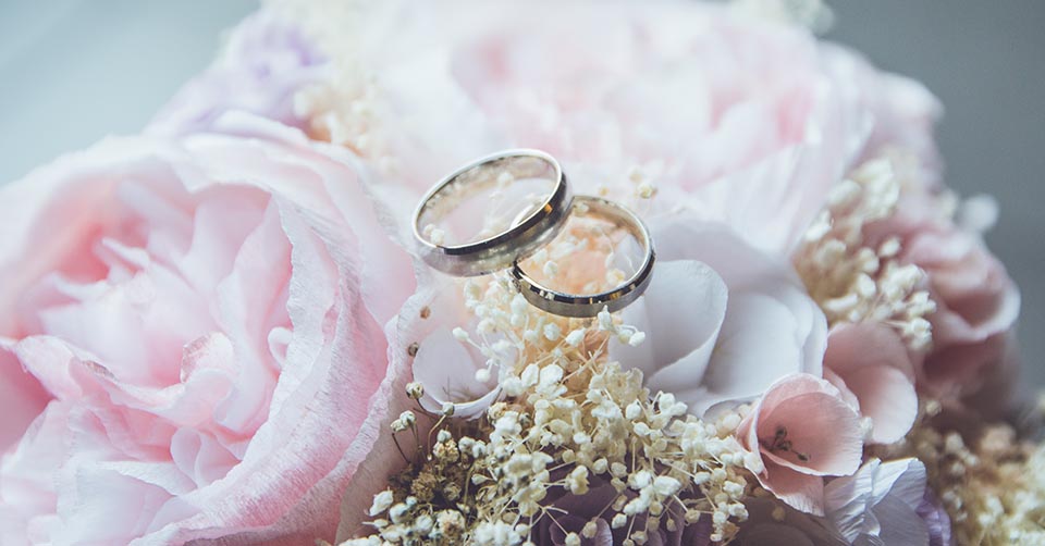 Wedding rings on a bouquet