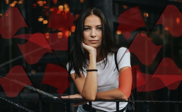 A woman surrounded by red flags