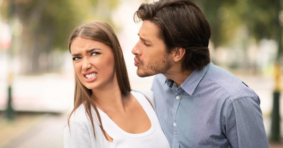 Refusing to kiss him because he has bad breath