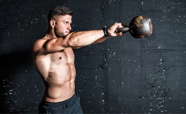 Doing one of the best kettlebell chest workouts