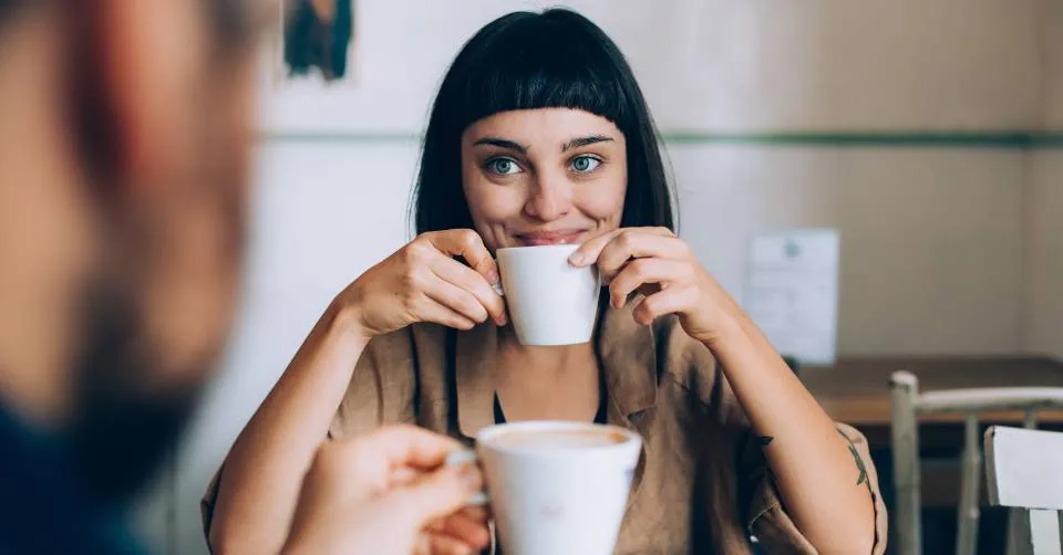 Smiling during her coffee date